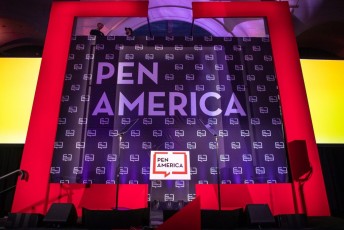 close up on Red AV-Drop Modular backdrop framing step and repeat for Pen America Fundraiser event