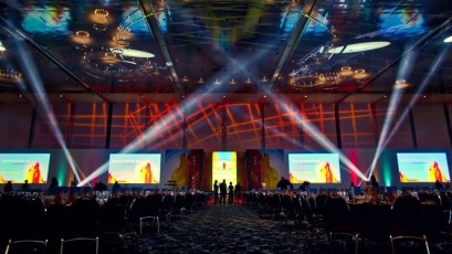 Multiple screen AV-Drop Modular Backdrop surround with recessed panels to create light cove set on stage for corporate event