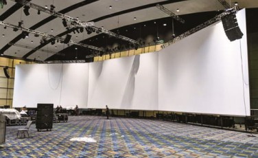 Seamless white AV-Drop Modular Backdrop for front projection set on rig in ballroom for corporate event