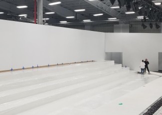 Mid setup, White Flat AV-Drop Modular backdrop walls to create room surround for fashion show