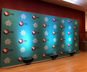 Step and repeat AV-Drop Modular Backdrop for PBS great American read event with up lighting